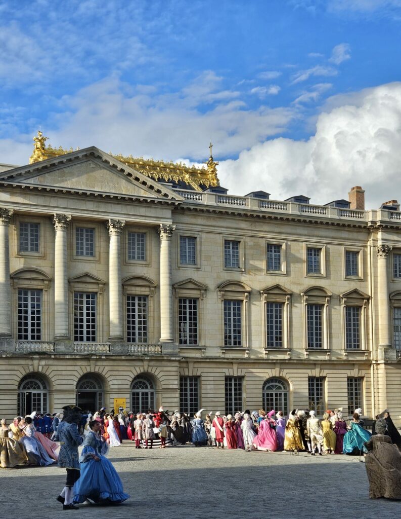 Guests in 18th-century costumes at Versailles Fêtes Galantes.